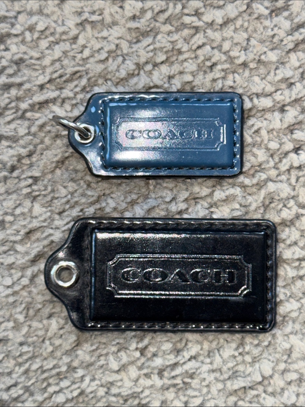 2 Coach Bag Tags. Black & Teal. Black 2.5”x1.25”. Teal 2”x1”.